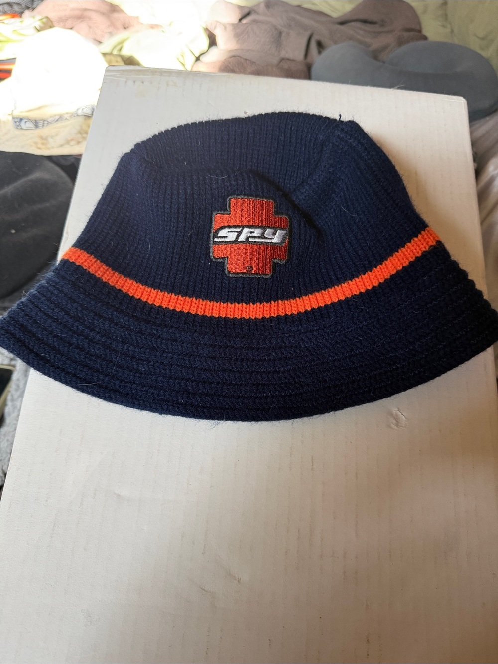 SPY Navy Knit Bucket Hat with Orange Accent